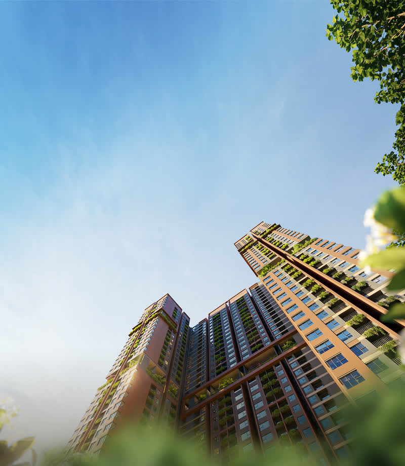 Tòa tháp Monrei Saigon nhìn từ dưới lên, mặt đứng lam gỗ và cây xanh