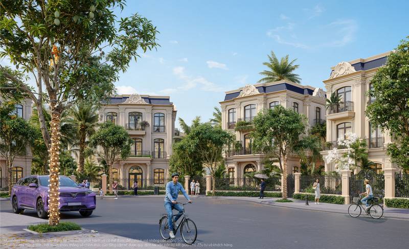 Biệt thự đơn lập tân cổ điển màu kem ở khu Vịnh Tiên, Vinhomes Green Paradise, đường nội khu rợp cây, xe VinFast