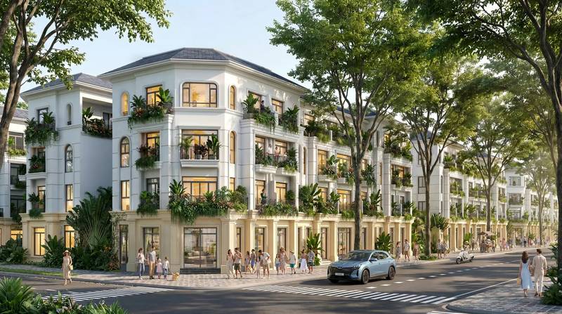 Dãy nhà liền kề tân cổ điển màu trắng ở góc phố, ban công cây xanh, tại Vinhomes Saigon Park