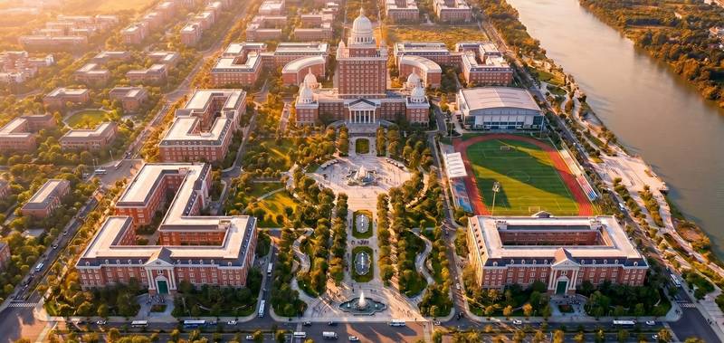 Phối cảnh quần thể đại học bên sông tại Vinhomes Saigon Park, có tòa mái vòm trung tâm và sân vận động